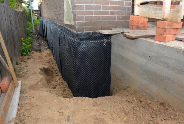 Happy homeowners after waterproofing job in Hanceville